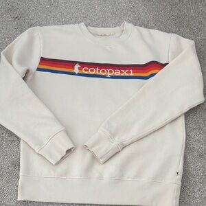 Cotopaxi Cream Sweatshirt with Rainbow Stripe